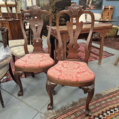 Lot 479 - A pair of George I style high-back chairs