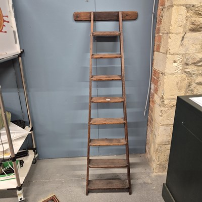 Lot 466 - An antique rustic pine library ladder, H 166 W...