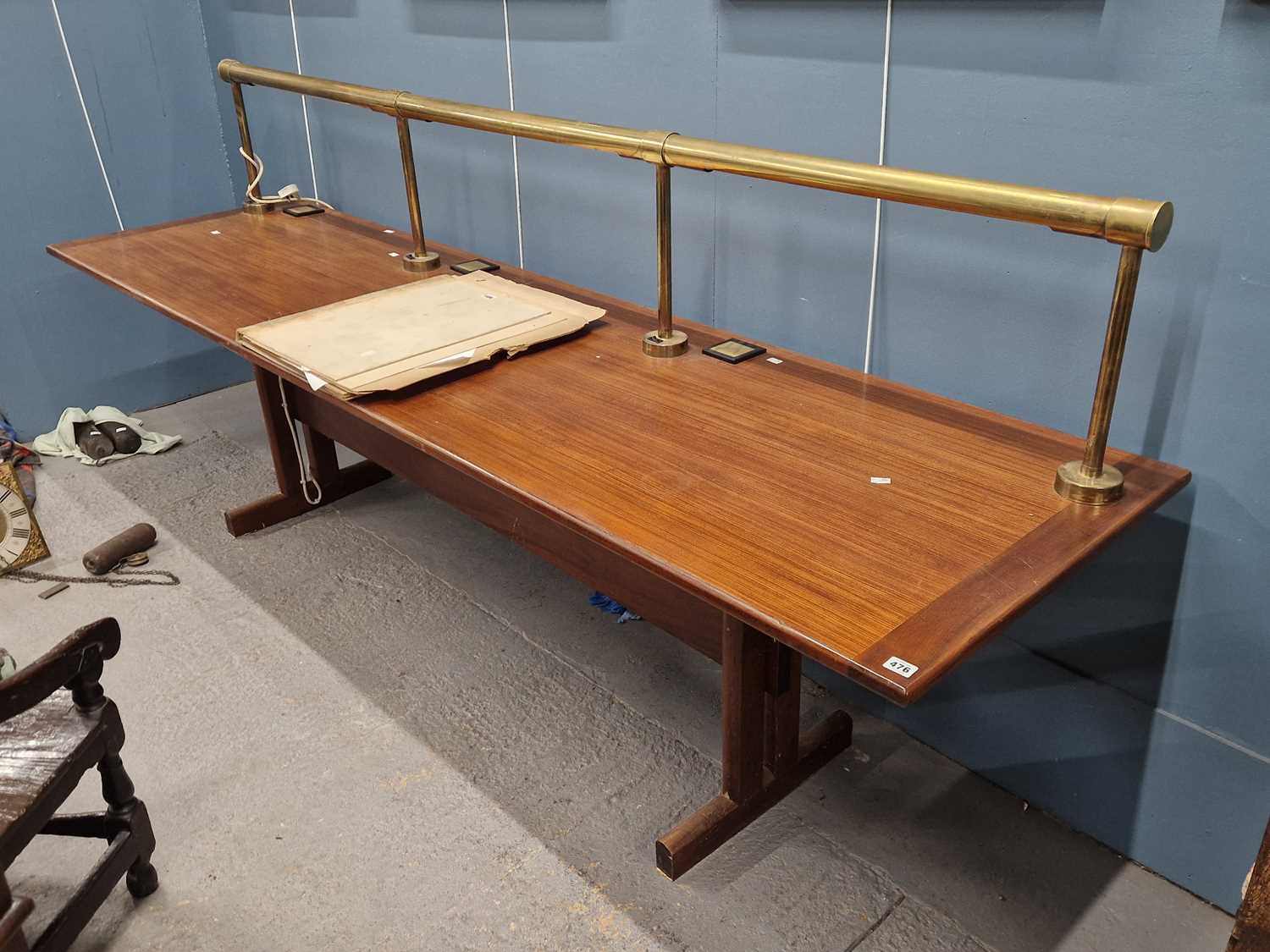 Lot 476 - A large hardwood library table with a brass