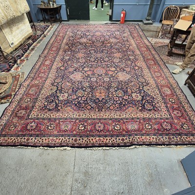 Lot 1242 - An old country house Persian carpet of classic...