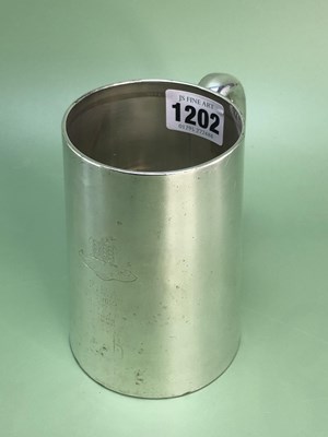 Lot 1202 - A presentation silver pint mug by William...