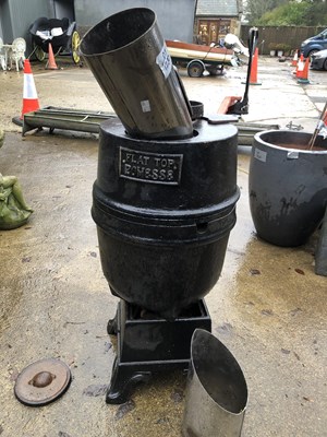 Lot 1280 - A Romesse Flat Top cast iron pot bellied stove