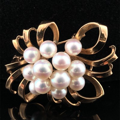 Lot 1003 - A hallmarked 9ct gold abstract floral spray...