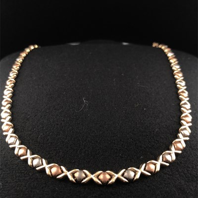 Lot 1004 - A 9ct hallmarked gold tri-colour necklace...