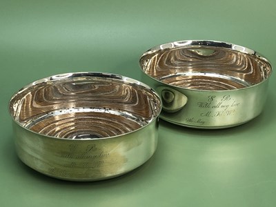 Lot 1227 - A pair of silver wine coasters by Gibson & Co.,...