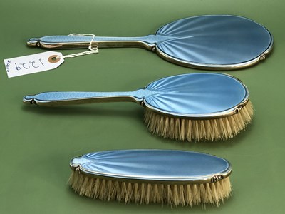 Lot 1229 - A sky blue enamelled silver three piece...