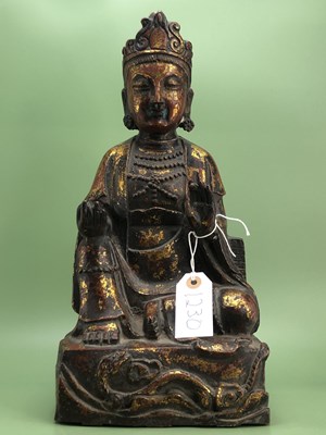 Lot 1230 - A parcel gilt bronze figure of the Buddha...