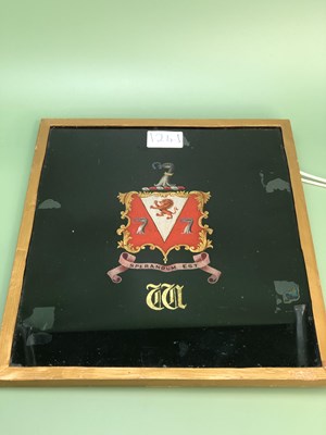Lot 1241 - A framed reverse glass armorial for the...