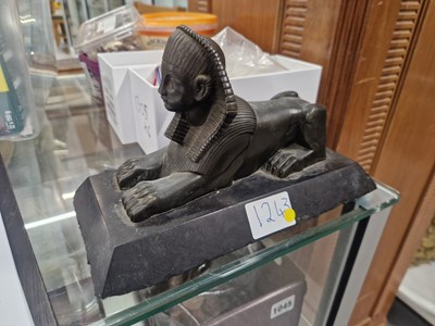 Lot 1243 - A bronze model of an Egyptian sphinx mounted...