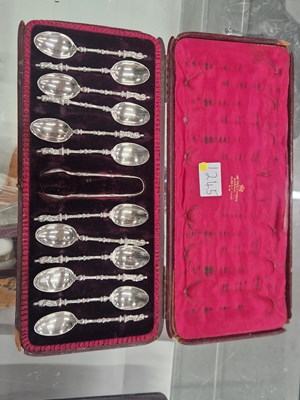 Lot 1245 - A cased set of twelve silver apostle tea...