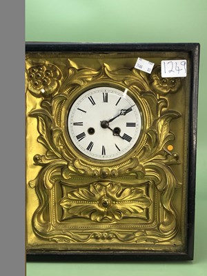 Lot 1249 - An ebonised framed wall clock striking on a...