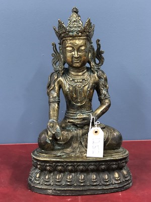 Lot 1252 - A polished bronze figure of the Buddha seated...