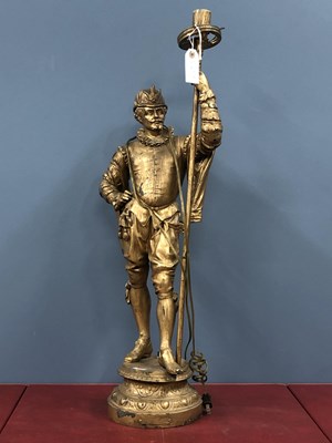 Lot 1255 - A gilt spelter Tudor period man standing...