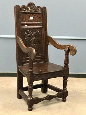 Lot 1262 - An 18th century oak wainscot chair, the wavy...
