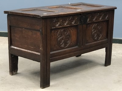 Lot 1264 - An 18th century oak coffer, the three panelled...