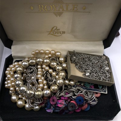 Lot 1037 - Two filigree triangular brooches, each with...