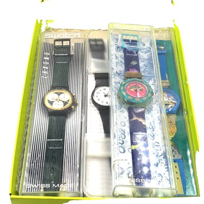 Lot 1038 - Three collectable Swatch watches to include:...