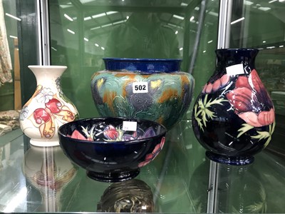 Lot 502 - A pottery planter, two Moorcroft vases and a bowl