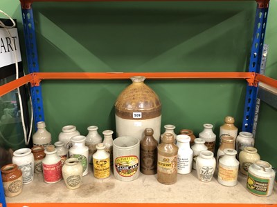 Lot 509 - A collection of stoneware bottles and jars...
