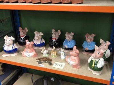 Lot 511 - Two sets of five Nat West pigs together with...