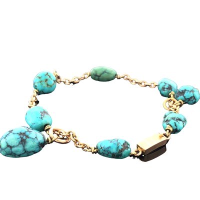 Lot 1062 - A vintage turquoise bead bracelet, comprising...