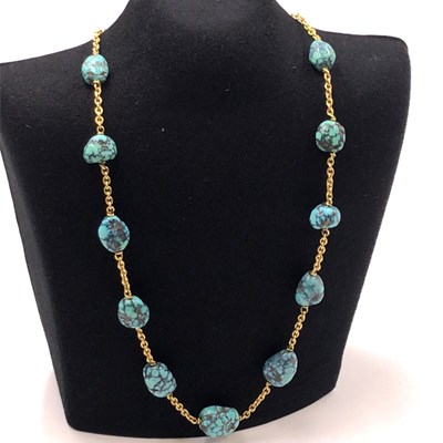 Lot 1063 - A vintage turquoise bead necklace, comprising...