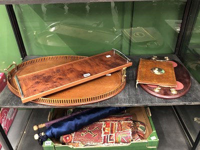 Lot 521 - A mahogany oval tray, two other wooden trays...