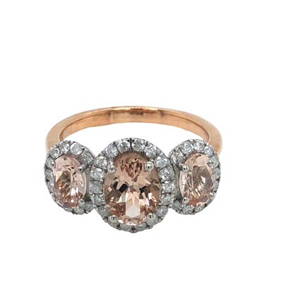 Lot 1058 - A 9ct rose and white gold trilogy ring set...