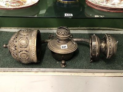 Lot 541 - A silvered metal wall mounting oil lamp