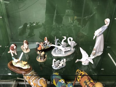 Lot 546 - Four Lladro bird groups together with five...