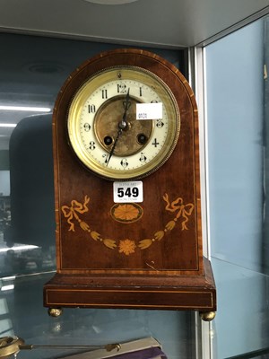 Lot 549 - A marquetried mahogany mantel clock striking...