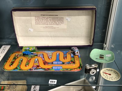 Lot 551 - A boxed clock work police vehicle and its...