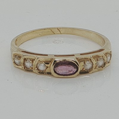 Lot 1082 - A stone set band, unhallmarked, assessed as...