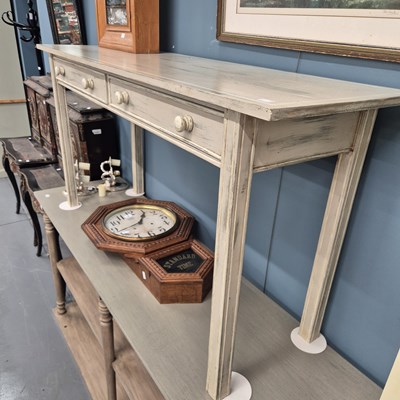 Lot 4 - A painted hall table with two drawers on...
