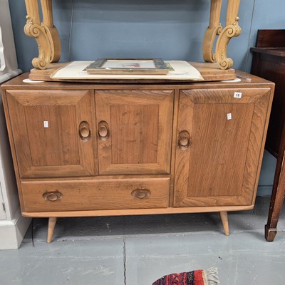 Lot 15 - An Ercol elm sideboard H 83 W 104 D 44cm