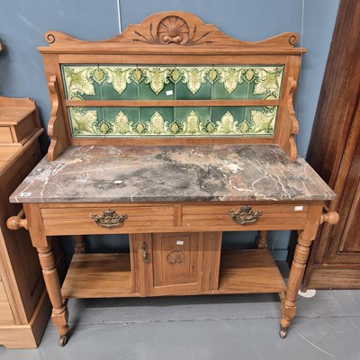 Lot 22 - An Edwardian satin walnut washstand with tiled...