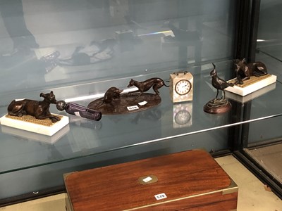 Lot 578 - A pair of bronze reclining greyhounds, a...