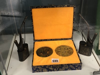 Lot 599 - A Case of two Chinese stone roundels together...