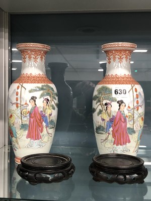Lot 630 - A pair of Chinese porcelain vases with wood...