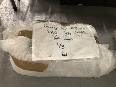 Lot 658 - A garage door motor with its screws