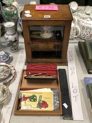 Lot 665 - A glazed oak smoker's cabinet, a slide rule, a...