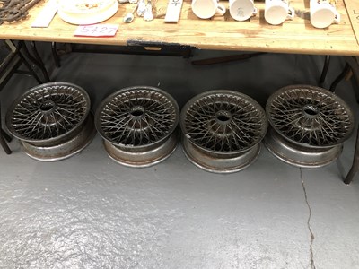 Lot 675 - A set of four chrome spoked car wheels