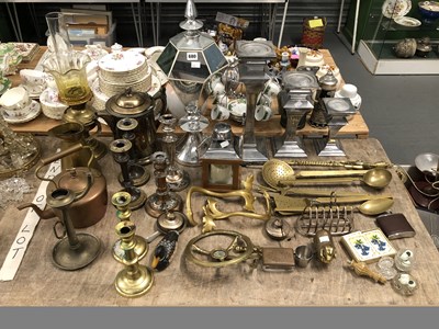 Lot 680 - A graded set of three chrome candle stands,...