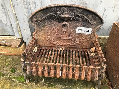 Lot 470 - A cast iron fire back with tray and grate