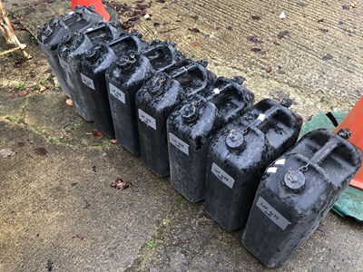 Lot 478 - A set of eight black plastic jerry cans, with '...