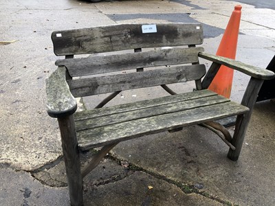 Lot 480 - A rustic garden bench. 121cm long