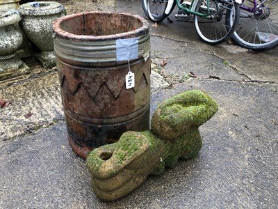 Lot 484 - A chimney pot along with a stone decoration