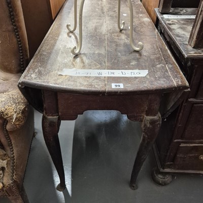 Lot 99 - An 18th century oak drop leaf dining table H...