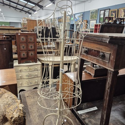 Lot 100 - A decorative wirework clothes dummy, together...