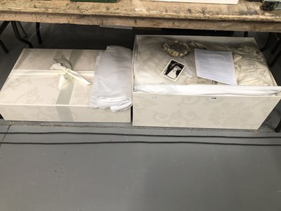 Lot 718 - A boxed wedding dress and veil